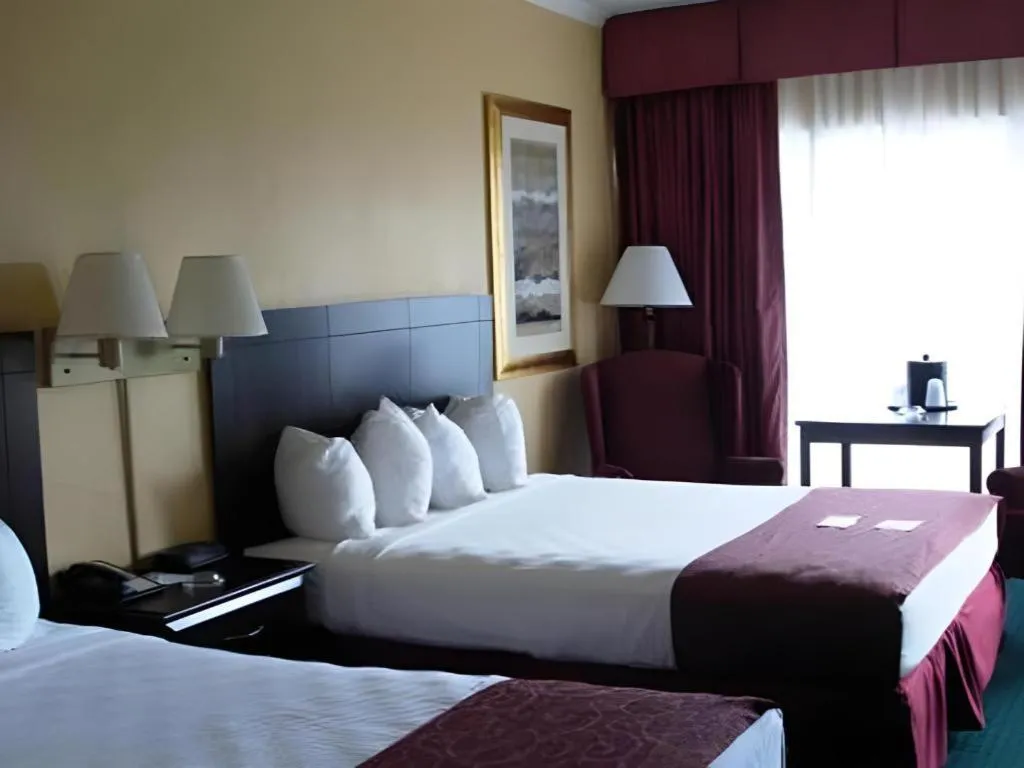 Bed in Magnuson Grand Conference Hotel