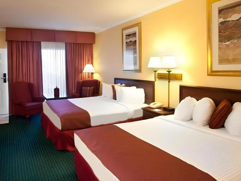 Bed in Magnuson Grand Conference Hotel