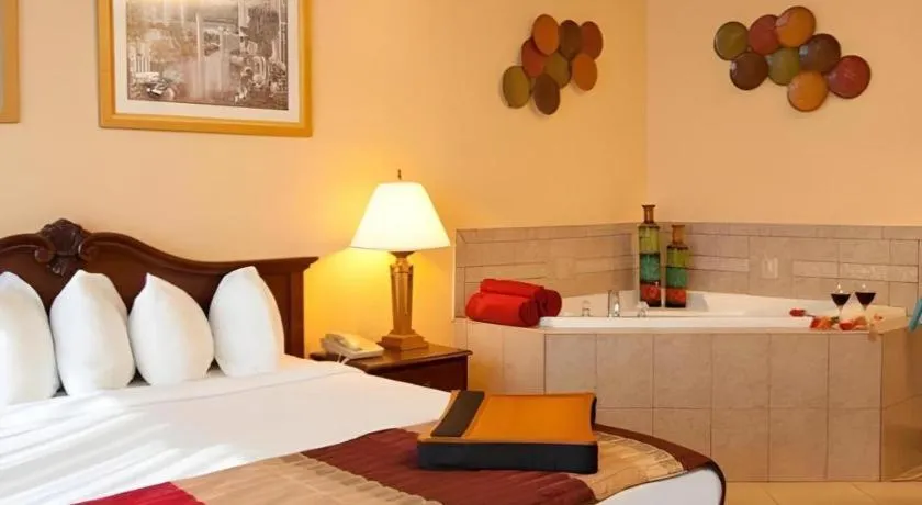 Bed in Magnuson Grand Conference Hotel