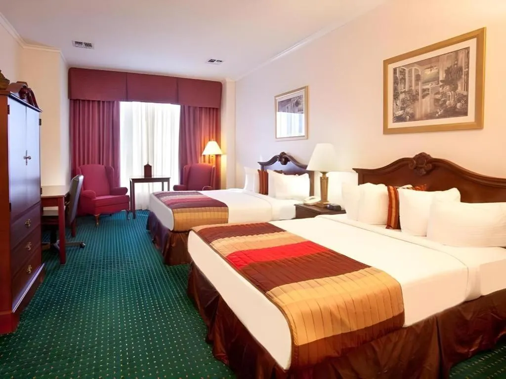 Bed in Magnuson Grand Conference Hotel