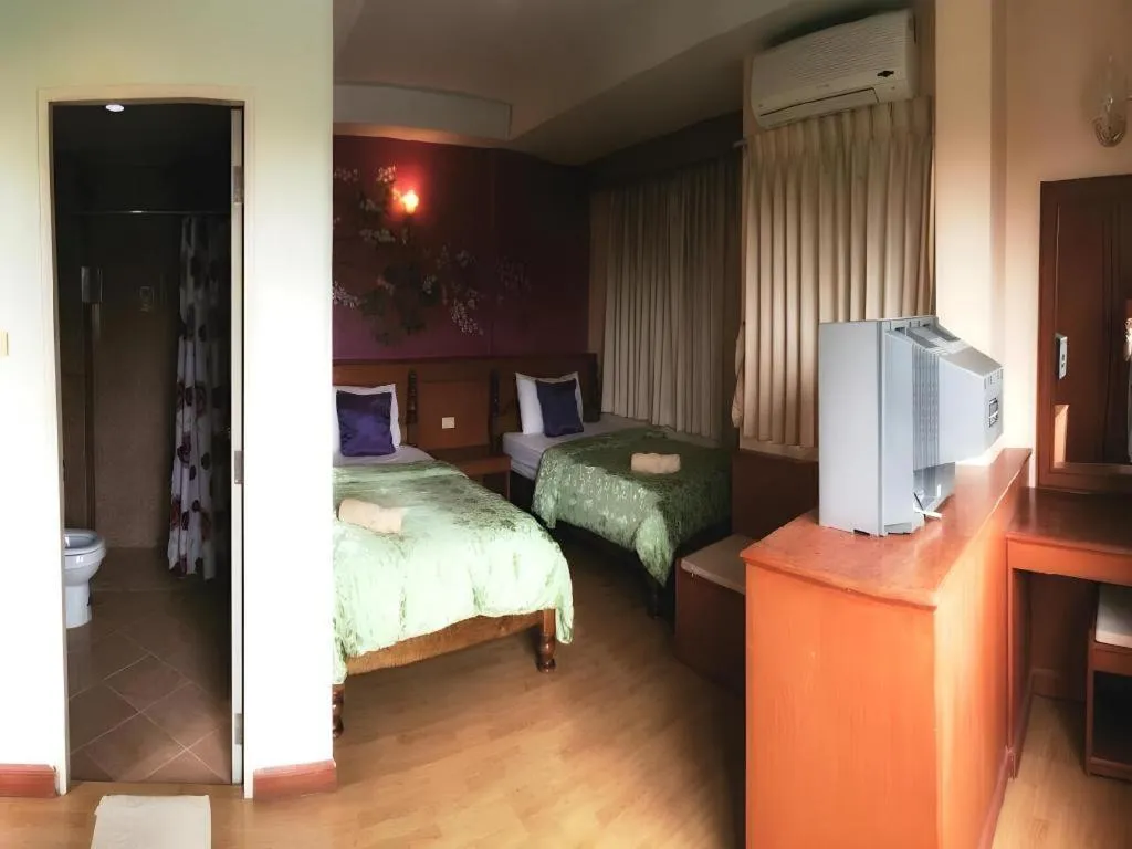 Bed in Loei Orchid Hotel