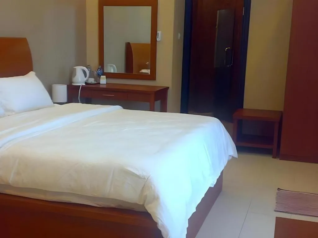 Bed in Hotel Minahasa