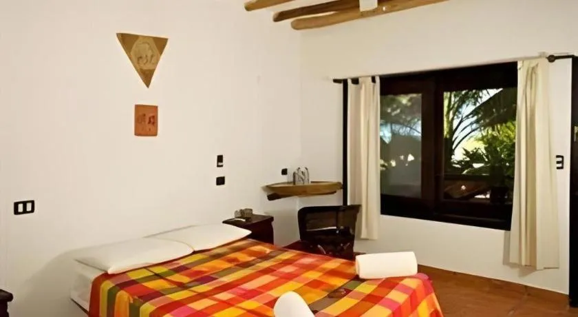 Bed in La Palapa Ethno Chic Hotel