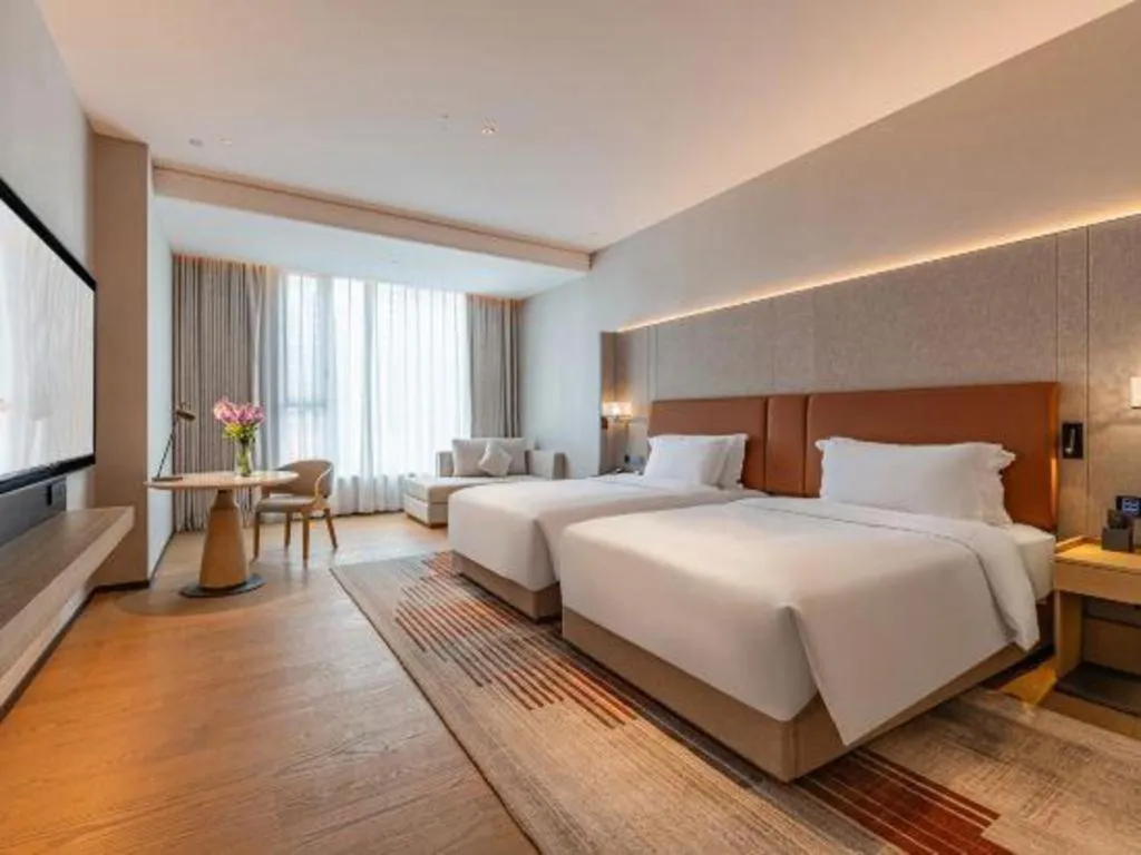 Bed in Dongguan Castfast Hotel