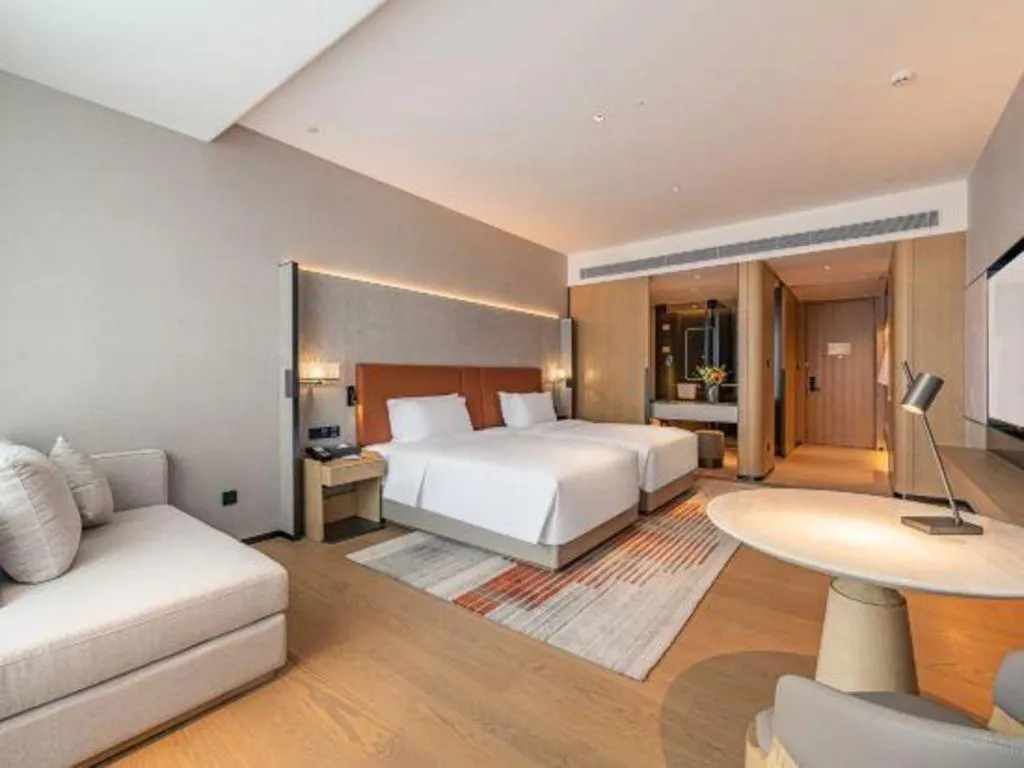 Bed in Dongguan Castfast Hotel