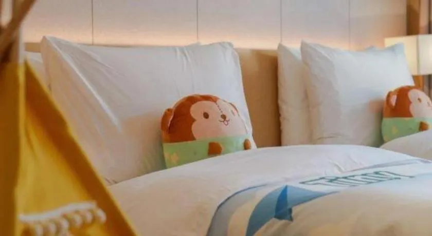 Bed in Dongguan Castfast Hotel