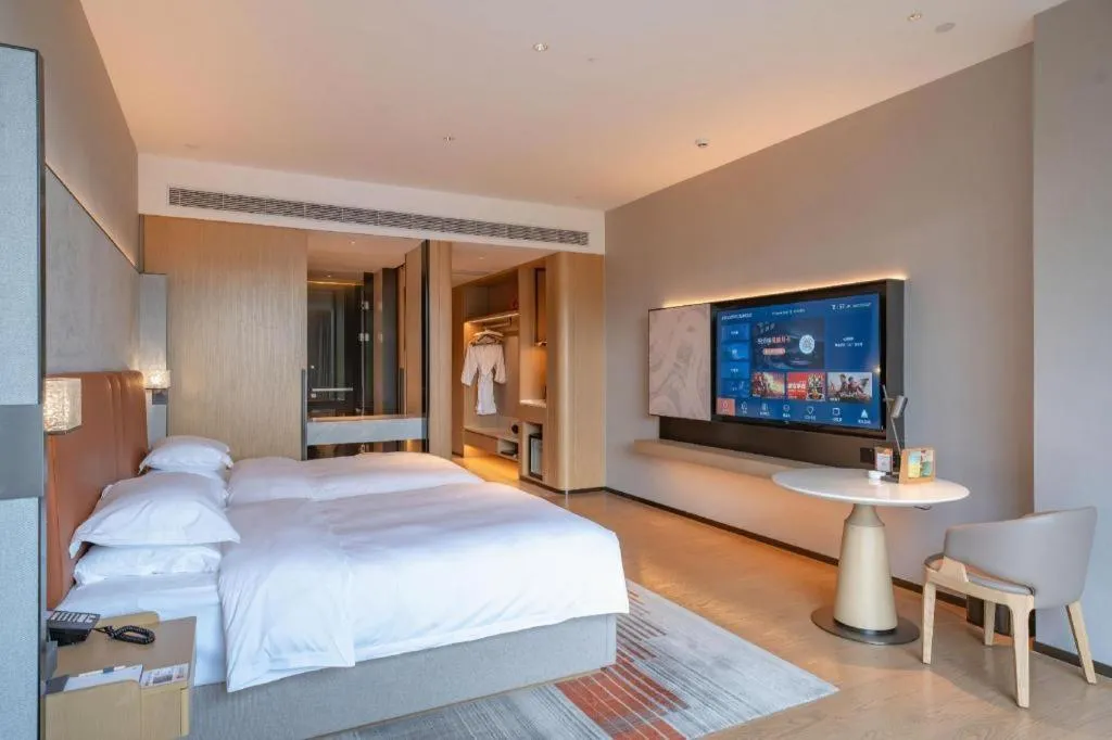 Bed in Dongguan Castfast Hotel