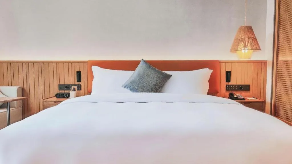 Bed in Dongguan Castfast Hotel