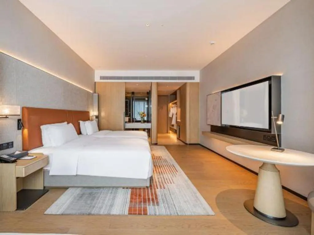 Bed in Dongguan Castfast Hotel