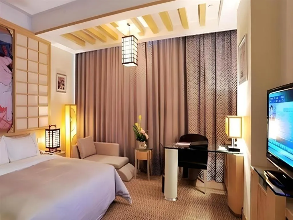 Bed in Dongguan Castfast Hotel