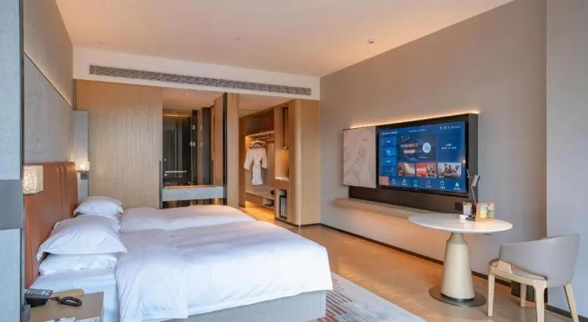 Bed in Dongguan Castfast Hotel