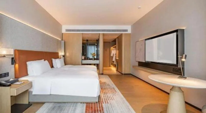 Bed in Dongguan Castfast Hotel