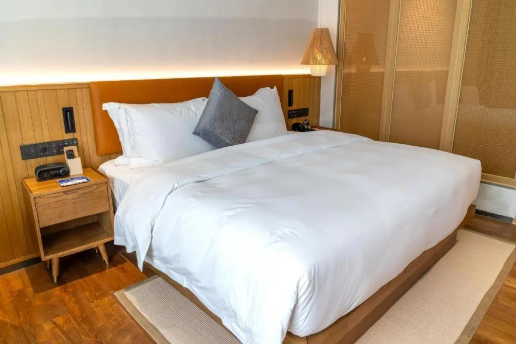 Bed in Dongguan Castfast Hotel