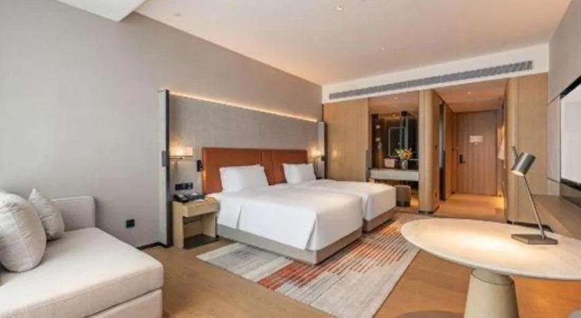 Bed in Dongguan Castfast Hotel