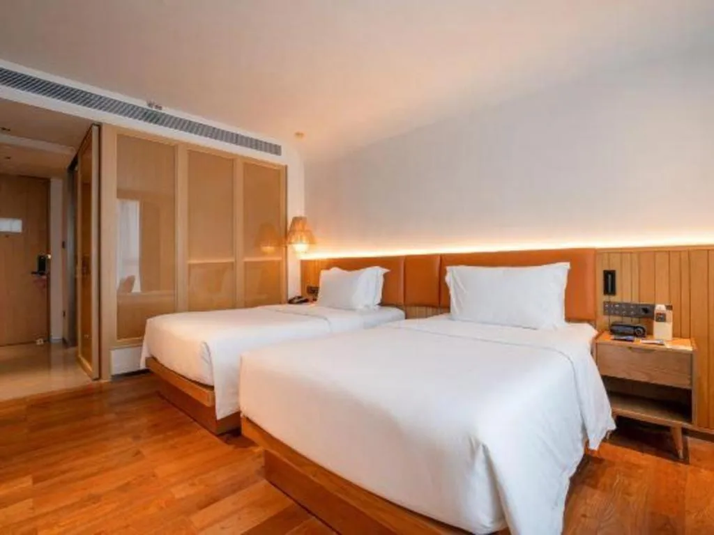 Bed in Dongguan Castfast Hotel