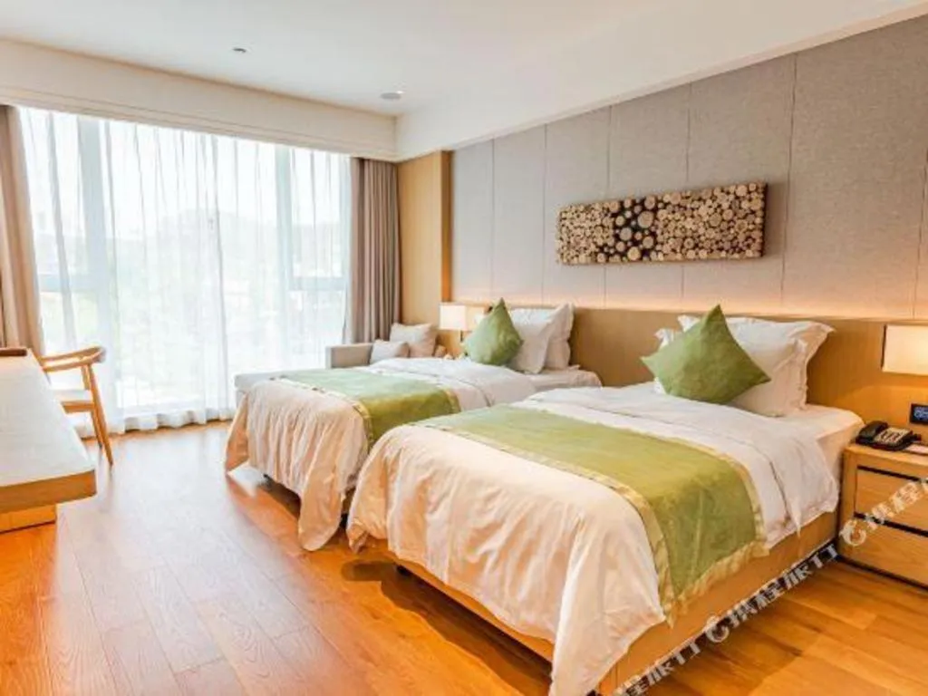 Bed in Dongguan Castfast Hotel