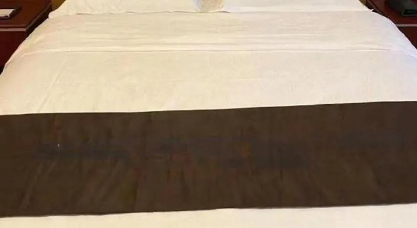 Bed in Qingdao Chengyang Detai Hotel