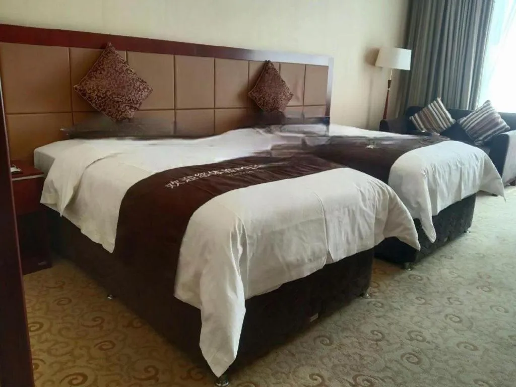 Bed in Qingdao Chengyang Detai Hotel