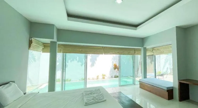 Bed in The Living Pool Villas