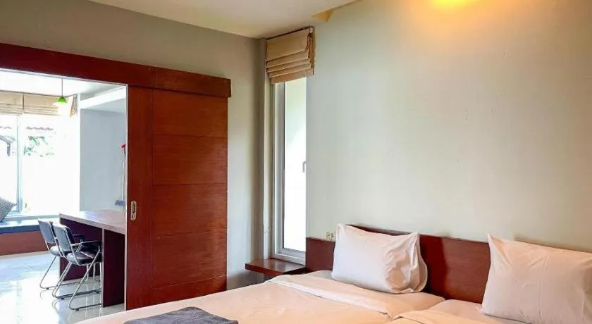 Bed in The Living Pool Villas