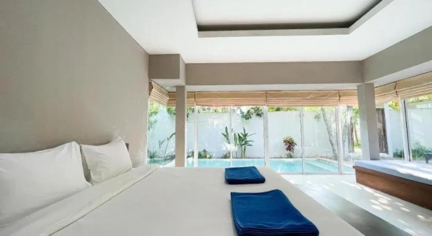 Bed in The Living Pool Villas