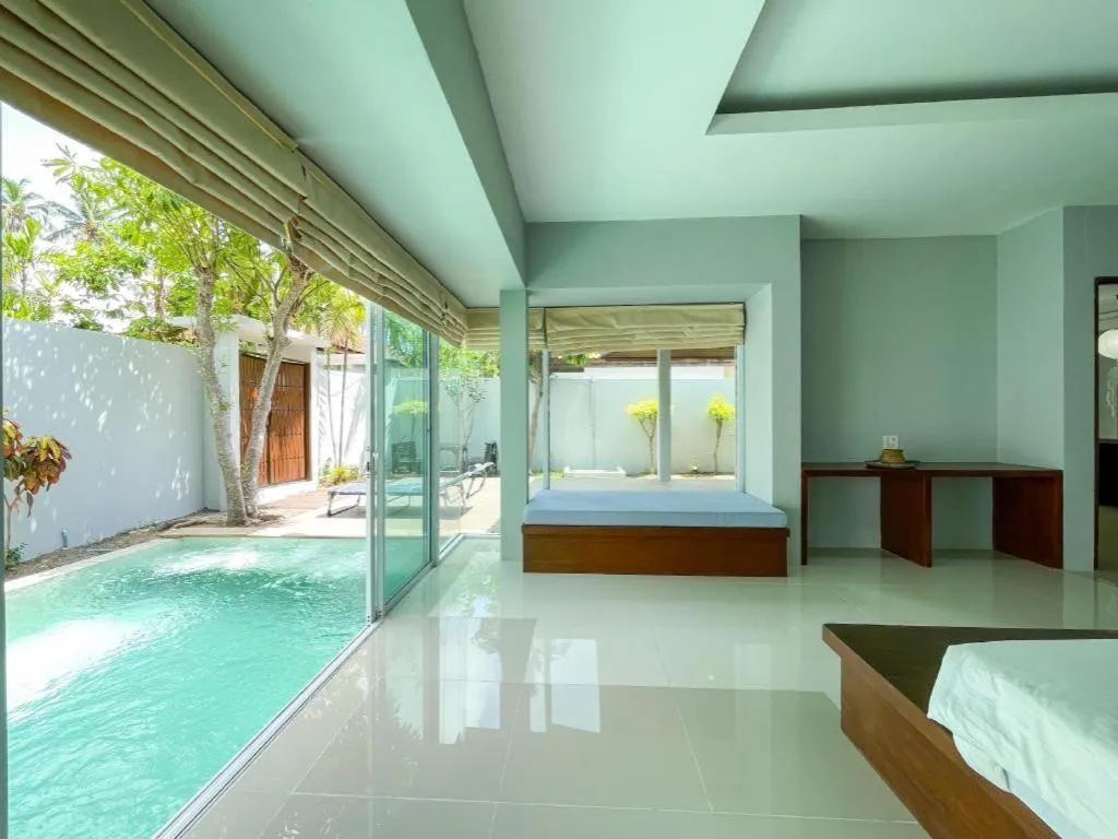 Bed in The Living Pool Villas