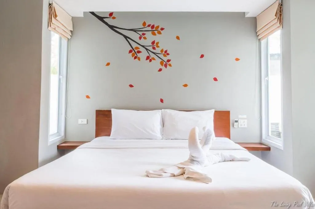 Bed in The Living Pool Villas