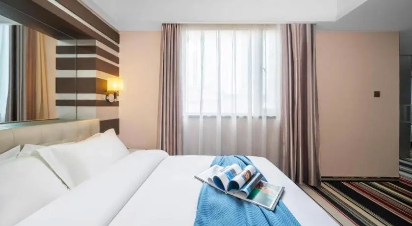 Bed in Urumqi Bayinhe Hotel