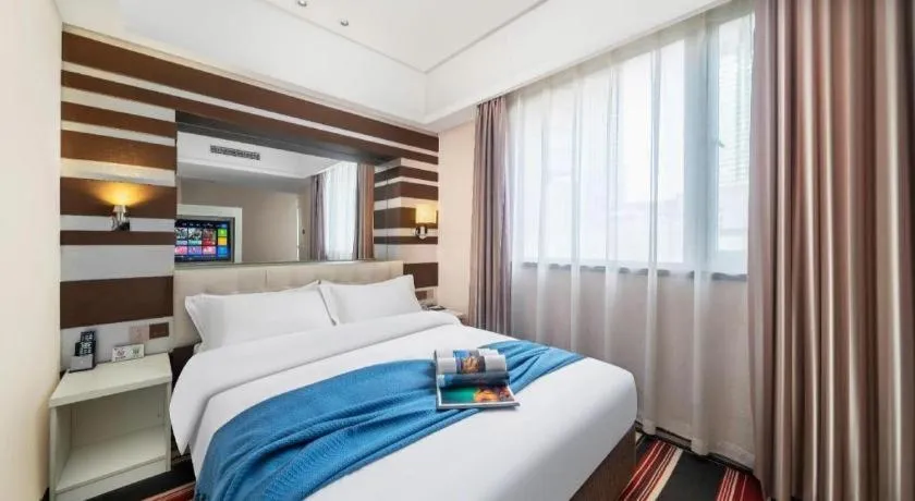 Bed in Urumqi Bayinhe Hotel