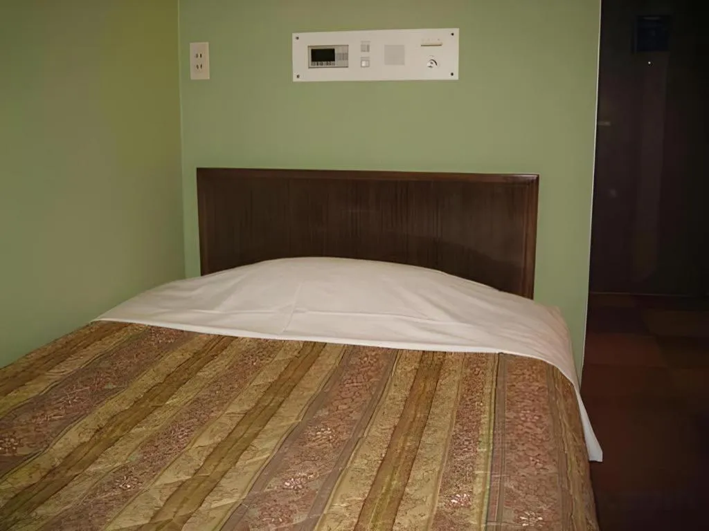 Bed in Hotel Akai