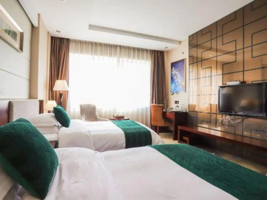 Bed in Fortune Hotel Longyan