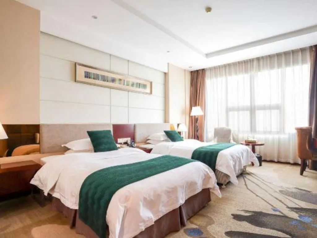 Bed in Fortune Hotel Longyan