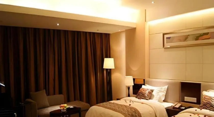 Bed in Fortune Hotel Longyan