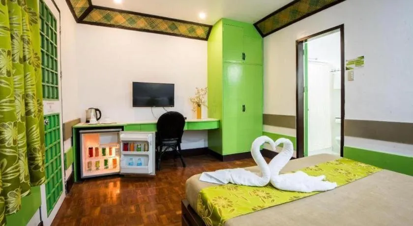 Bed in Family Country Hotel and Convention Centre