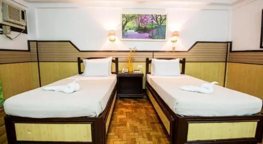 Bed in Family Country Hotel and Convention Centre Bed in Family Country Hotel and Convention Centre