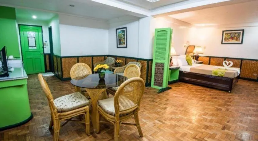 Bed in Family Country Hotel and Convention Centre