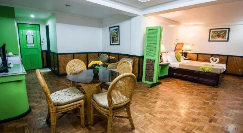 Bed in Family Country Hotel and Convention Centre