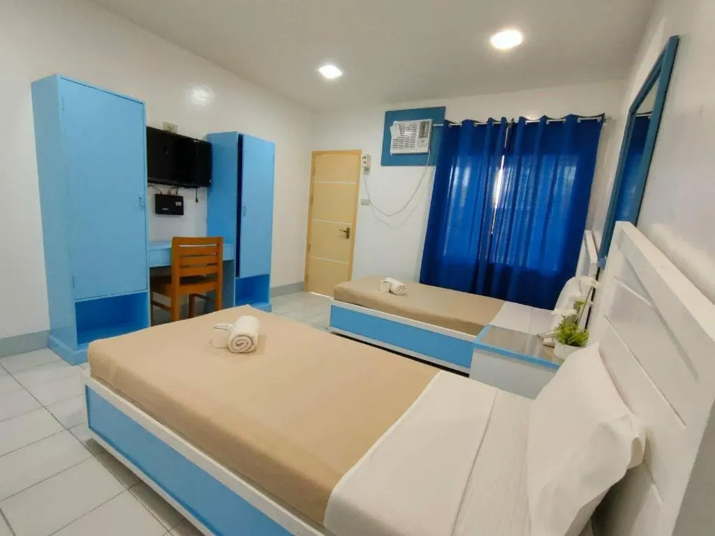 Bed in Family Country Hotel and Convention Centre