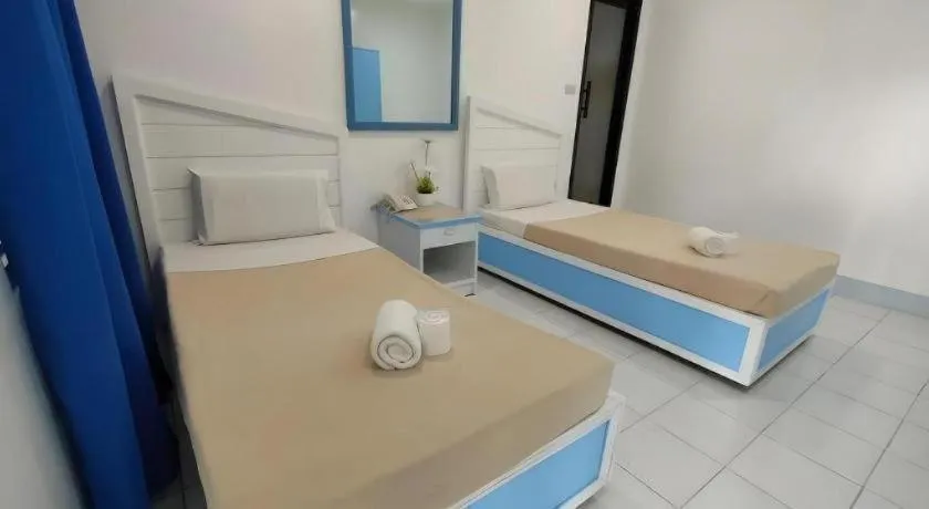 Bed in Family Country Hotel and Convention Centre