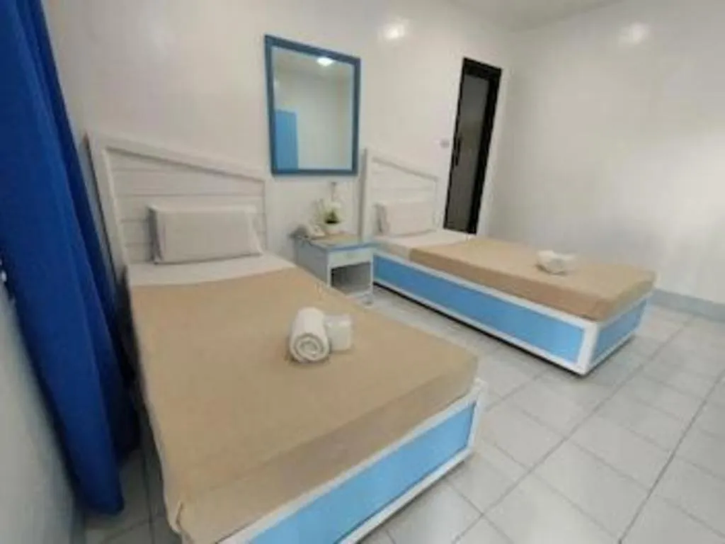 Bed in Family Country Hotel and Convention Centre