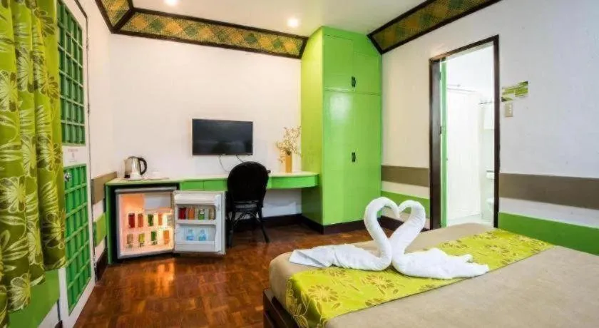 Bed in Family Country Hotel and Convention Centre