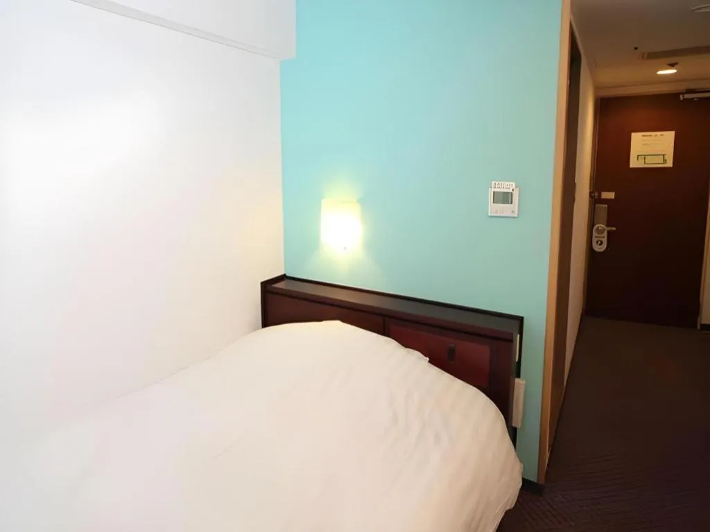 Bed in Oita Century Hotel