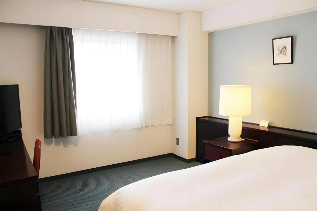 Bed in Oita Century Hotel