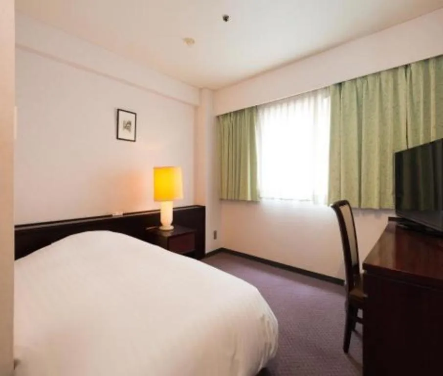 Bed in Oita Century Hotel