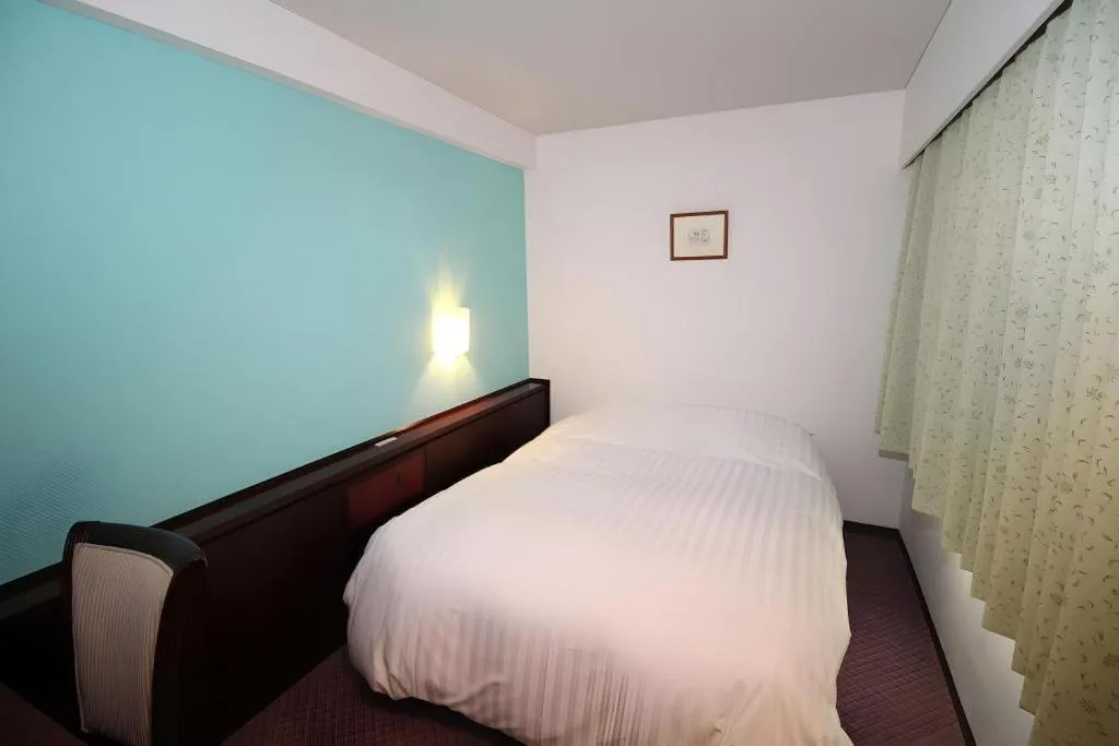 Bed in Oita Century Hotel