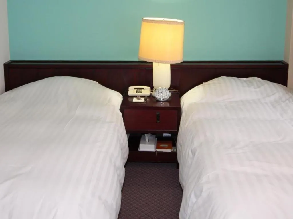 Bed in Oita Century Hotel