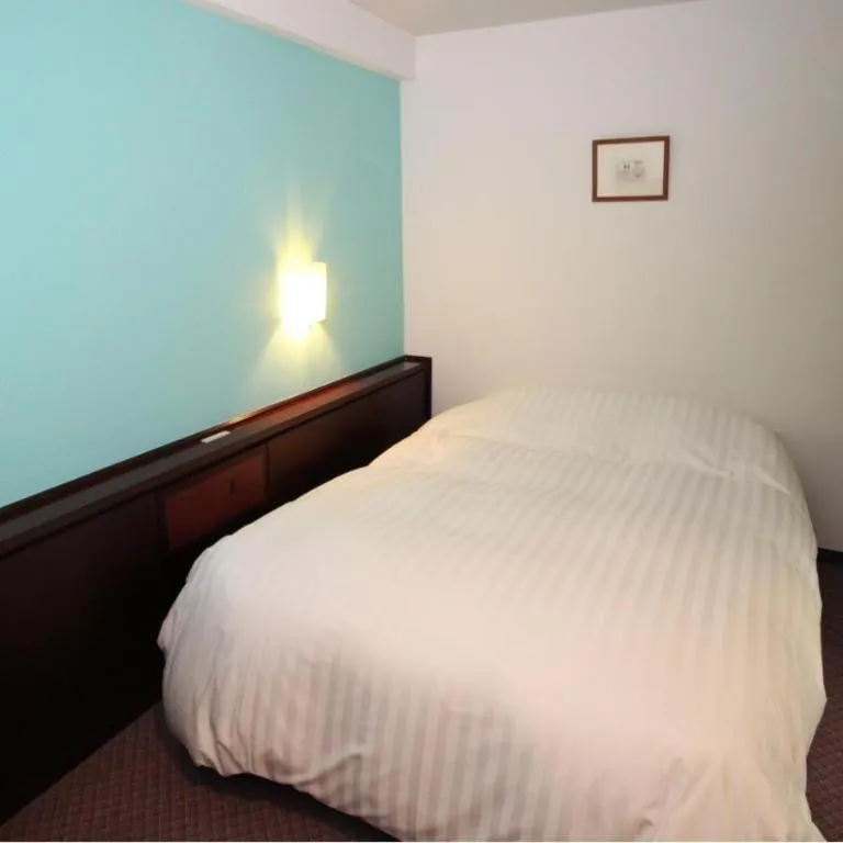 Bed in Oita Century Hotel