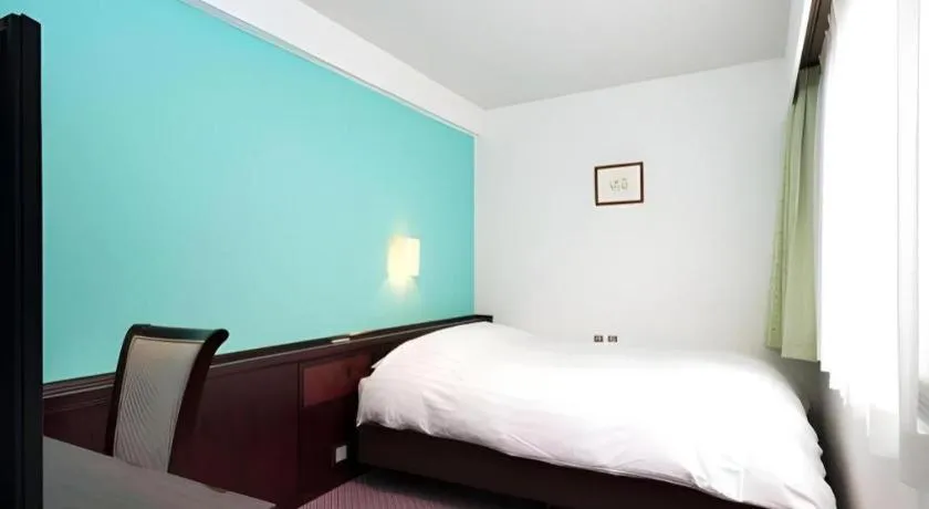 Bed in Oita Century Hotel