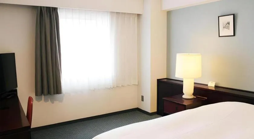 Bed in Oita Century Hotel