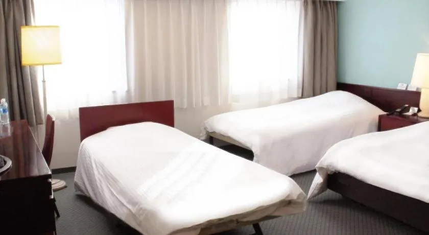 Bed in Oita Century Hotel